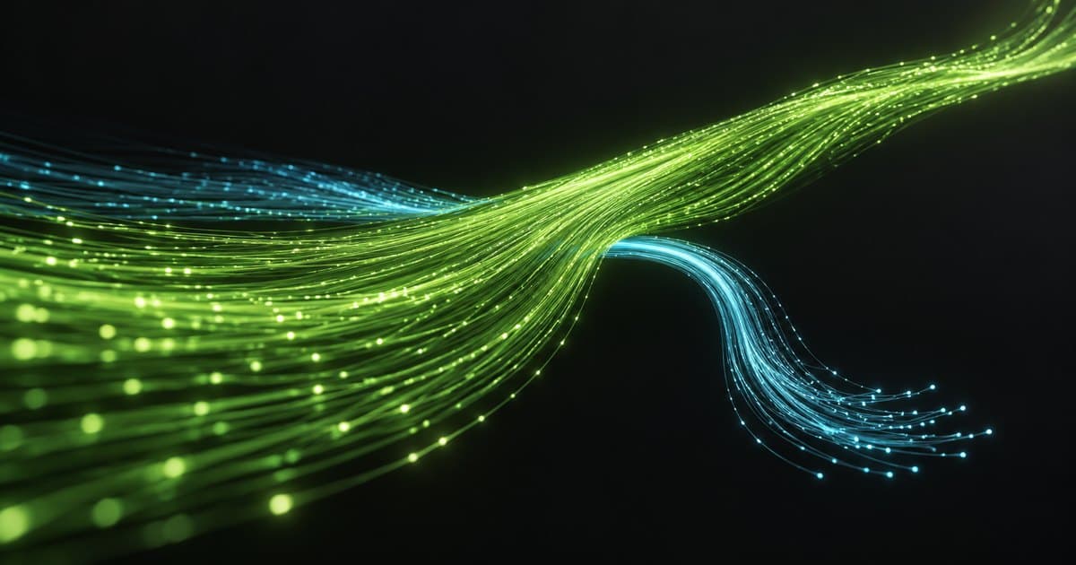 A continuous green stream of light fibers flows forward while a cyan strand curves away